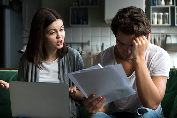 A female financial coach giving advice to her client on how to manage personal debt in South Africa.