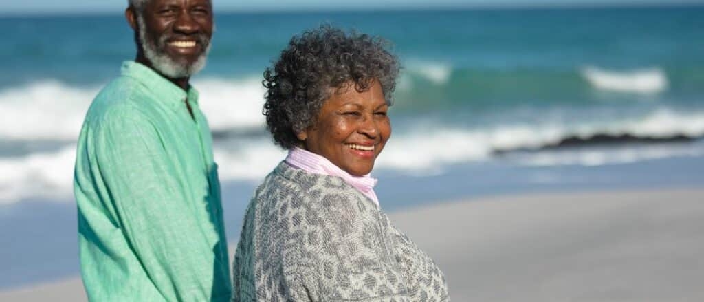 Happy mature couple enjoying retirement lifestyle together outdoo