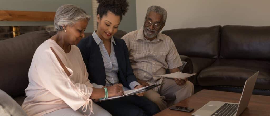 Advisor helping a couple plan financially for retirement