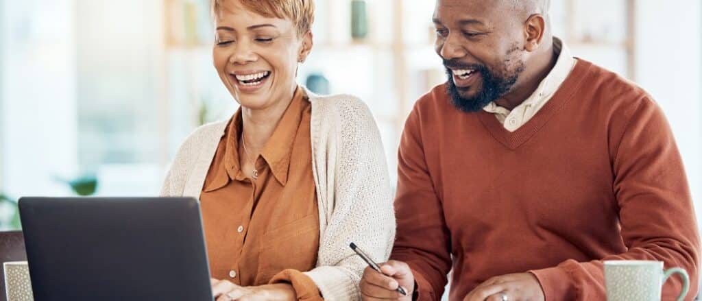 Advisor helping a couple plan financially for retirement